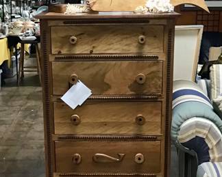 Designed and handcrafted by Will Armstrong from Oak and Nebraska Walnut. Each knob, each piece of trim work, the hand carved whale near the bottom of the chest were all carved by Will. They will never be another piece like this. Like Will, it is unique in every way.