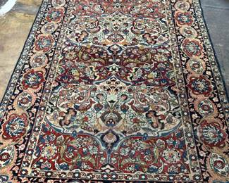 Hand knotted wool Persian rug. 5.6 x 8.3