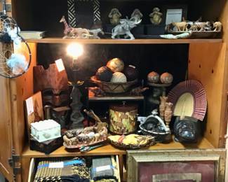 African themed collectibles including a carved tribal mask.