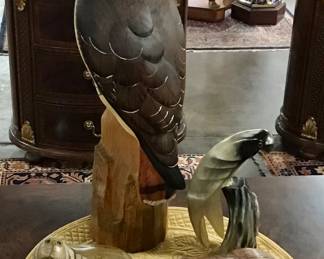 Limited Edition carved red tail hawk by K. W. White. Vintage carved horn parrot, carved stone water buffalo, Glenn Heath carved soapstone walrus. 