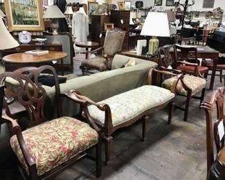 Carved walnut window bench with open arms.  Two vintage Baker Furniture Georgian style mahogany arm chairs, priced separately.