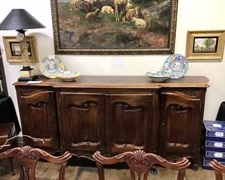 Louis XV walnut sideboard. Circa 1800s. Ornately carved. And exceptionally fine piece. 