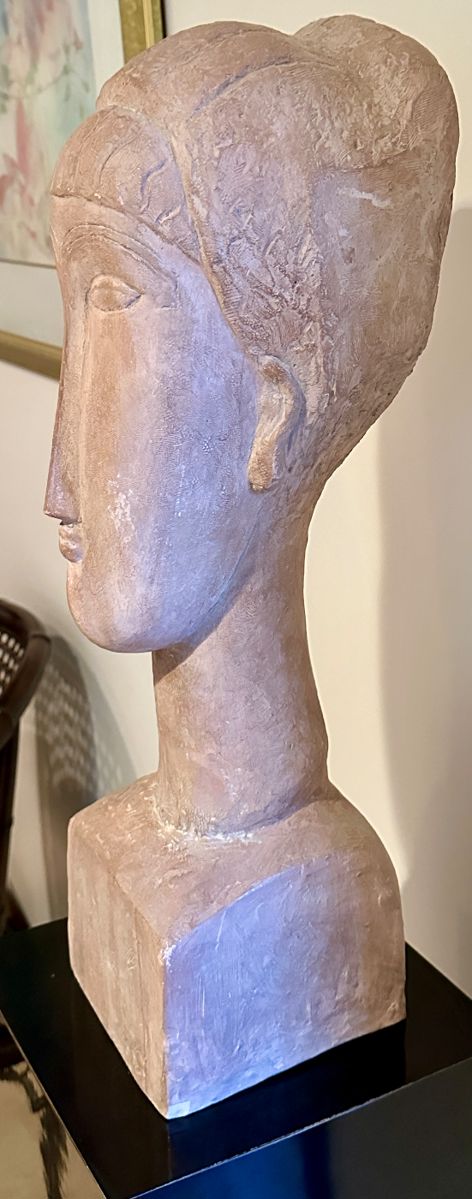 Arist: Austin Productions, after Amedeo Magdigliani.  Title: Tete' de Femme, Year: 1961-1963 in  Medium Terracotta.  Reproduction of original impressionist and Modern Art circa 1911 by Amedeo Magdigliani in Clay.  The Original Limestone Sculpture by Magdigliani was offered by Christies at $30MM - 40MM.