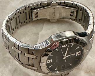 Rare Stainless Steel Men's Concord Saratoga (Model 14.C2.1894 with Black Face and Date Complication. Very collectible Swiss-Made Quartz Movement. Stainless Steel Band with deployment buckle.