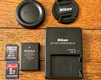 Awesome Nikon D3100 Digital SLR Camera with Nikon DX AF-S NIKKOR 18-55mm 1:3.5-5,6G. Built-In Flash, Nikon Battery LITHIUM ION BATTERY PACK EN-EL14
7.4 V 1030mAh 7.7 Wh, 2 8G and BATTERY CHARGER MH-24, 2 Fujifilm 8G Elite and Performance SD Cards.
