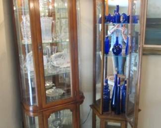 Lighted Cabinets with collectible blue glass and crystal.