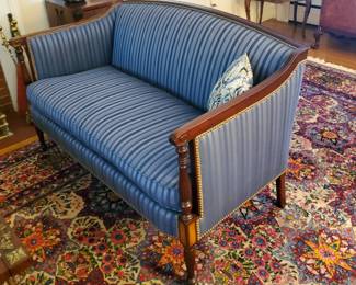 Pair of Regency style settees in blue striped upholstery. 