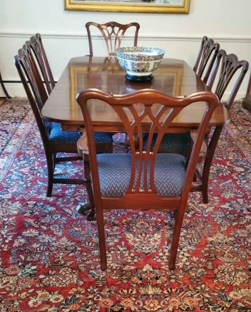 Double pedestal dining table. With pads. Set of six Chippendale style chairs. Excellent condition. 