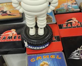 Advertising collectibles.  Michelin man bobblehead, vintage camel cigarette tins 