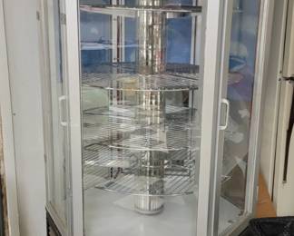 This is a glass  (lighted,  revolving,  combination refridgerator/freezer) pie display case.  Sold as is.  He used it to display cars. It makes a beautiful display case.