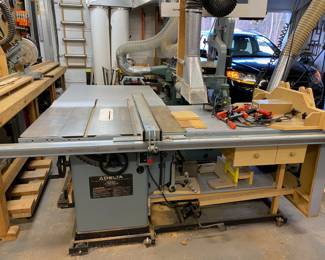 Delta Unisaw 10” tilting Arbor Saw with extension table
- Tilt-up router table connected to this on the far right