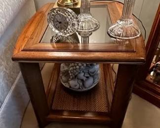 Side tables with smoke glass and cane inserts. We have 4 of these
