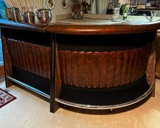 Leather and wood vintage bar. Two pieces and has shelving inside 