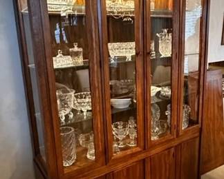Mid-Century China cabinet with light measures 54” wide x 79” tall x 14” deep