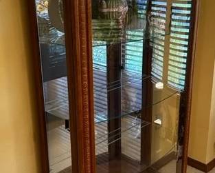 China cabinet measures 31” wide x 55” tall x 14” deep. Openings on side panels 