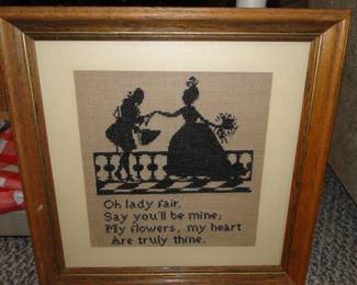 A lot of time, and a lot of patience went into making this wonderful piece.  That's a whole lot of cross-stitching