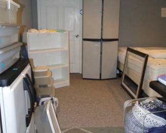 King adjustble bed far right, and lots and lots of storage bins too