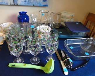 A grand and glorious collection of kitchen items and storage items as well as a nice selection of vases.