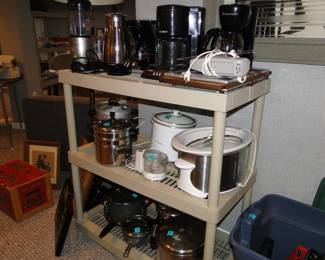 Yes the shelving unit along with all these pots and pans, and slow cookers, and coffee makers are for sale