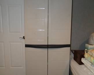 Tall plastic storage closet