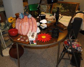 Nice round folding table, with lots of pretty decorative items on it