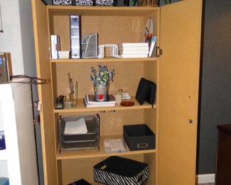 Large storage cupboard with some nice office supplies and necessities.
