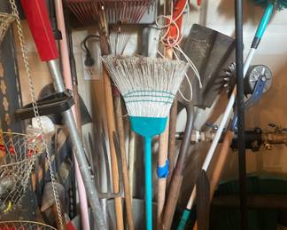 Assortment of Rakes and Shovels