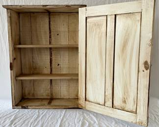 VIEW OF CUPBOARD OPENED 