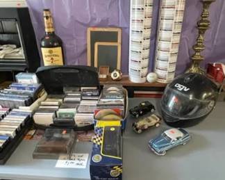 Cassettes, Die Cast autos, baseball cards, chalkboards, candlestick, motorcycle helmet