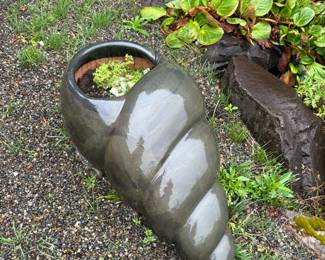 Massive shell shaped garden pot.