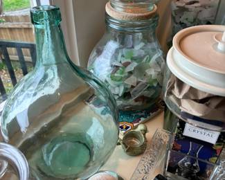 Large glass vases full of sea glass