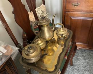 Brass tea service and dining room table and chairs