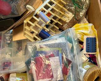 Boxes of sewing notions and crafting supplies