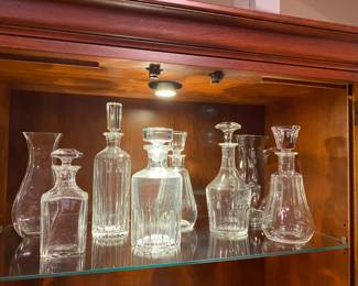 Huge assortment of Baccarat decanters.