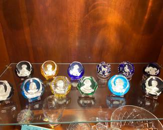 Baccarat famous personage paperweight collection.