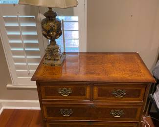 Pair of bedside dressers with matching lamps.