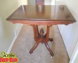 Victorian Carved Edge Table with Porcelain Castors