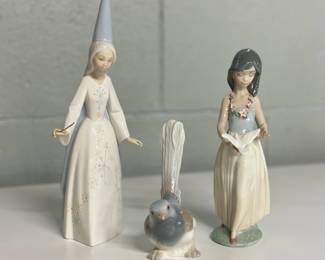 Trio of Lladro Figurines: Long Tailed Wren #1054, Fairy Godmother #4595 & Polynesian Love #6157.  