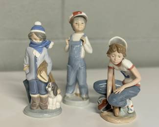 Trio of Lladro Figurines: Little Leaguer Catcher #5290, Winter Boy with Dog #5220 & Boy from Madrid #4898.