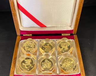 Gold coin set in lucite