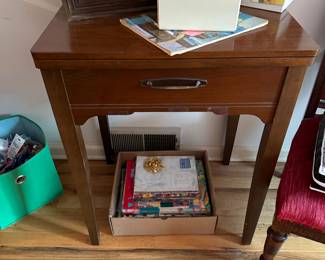 singer sewing machine in cabinet