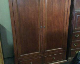 entertainment center w/ roll bk doors $75