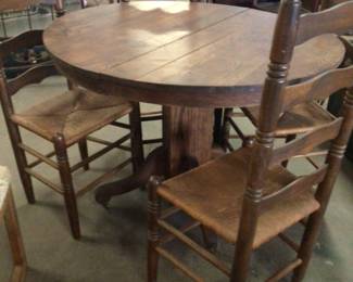 Oak round table with 4 ladder back chairs $275.