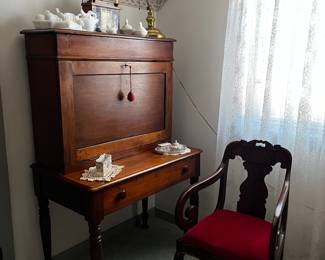 Wonderful plantation desk with lovely rosewood Empire arm chair.