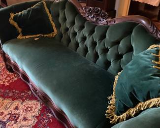 One of many tufted sofa's and settee's. This one is rosewood and a very early piece. Not one reproduction in the house.
