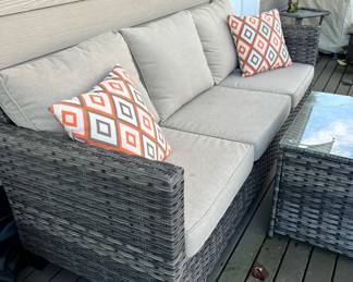 Outdoor Wicker Sofa with Tan Cushions & Glass Top Table