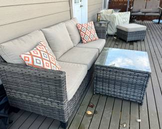 Outdoor Wicker Sofa with Tan Cushions & Glass Top Table