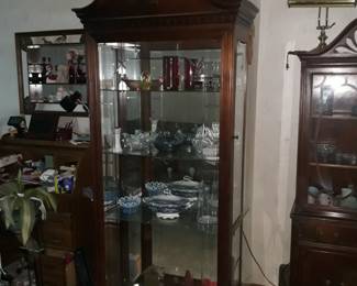Curio cabinet
32" w x 18" deep
Lighted, mirrored  back, glass shelves