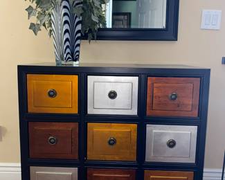 9 Drawer Accent Cabinet
Artificial plant in glass vase