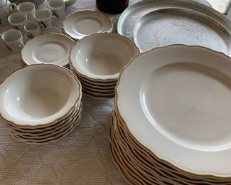 Syracuse China large set of gold-rimmed dishes 